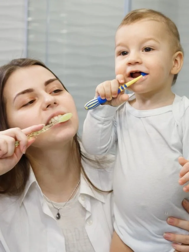 a-parent-brushing-a-baby's-teeth