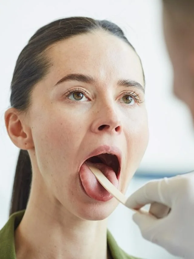 dentist-checking-a-patient's-mouth