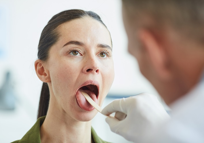 dentist-checking-a-patient's-mouth