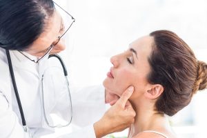 dentist-checking-a-womans-jaw