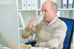 Businessman drinking water