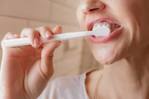 Woman Brushing Teeth