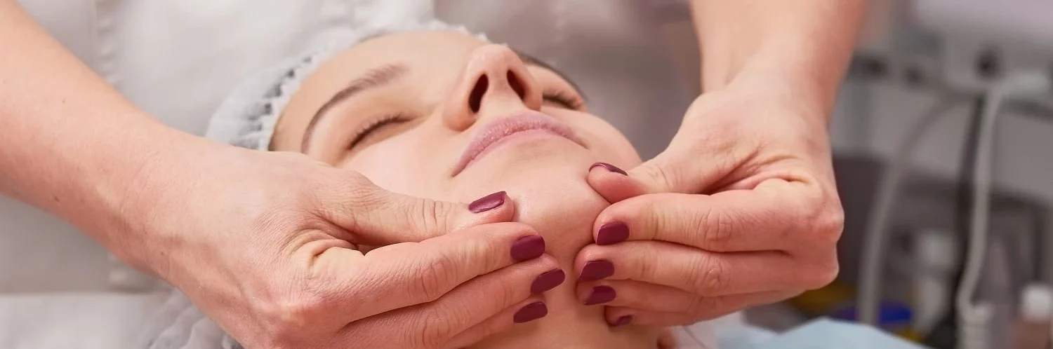 hands-massaging-face
