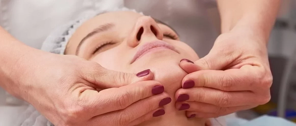 hands-massaging-face
