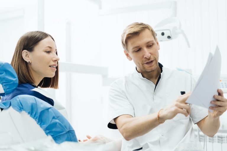 Dentist discussing with patient treatment plan