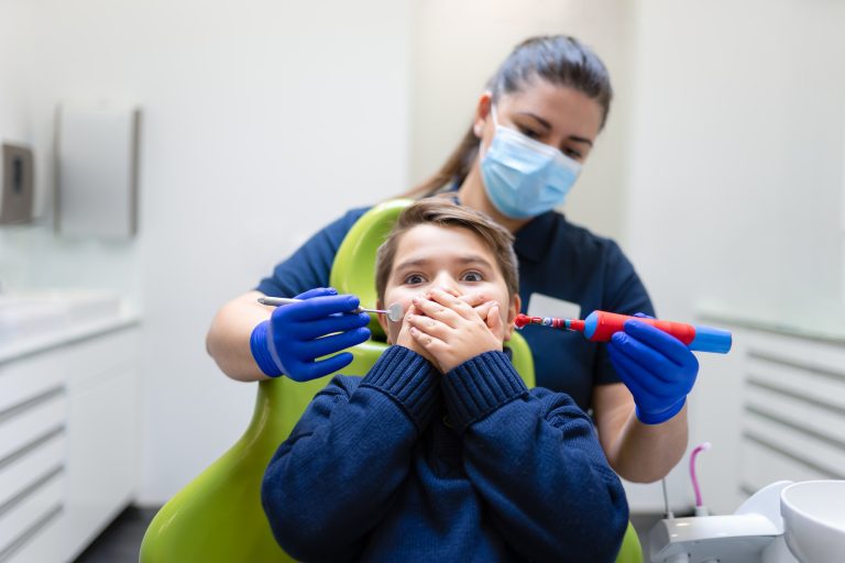 Behavior Management and sedation 5 Teen doesn't want to do oral hygiene. Pediatric dentistry concept