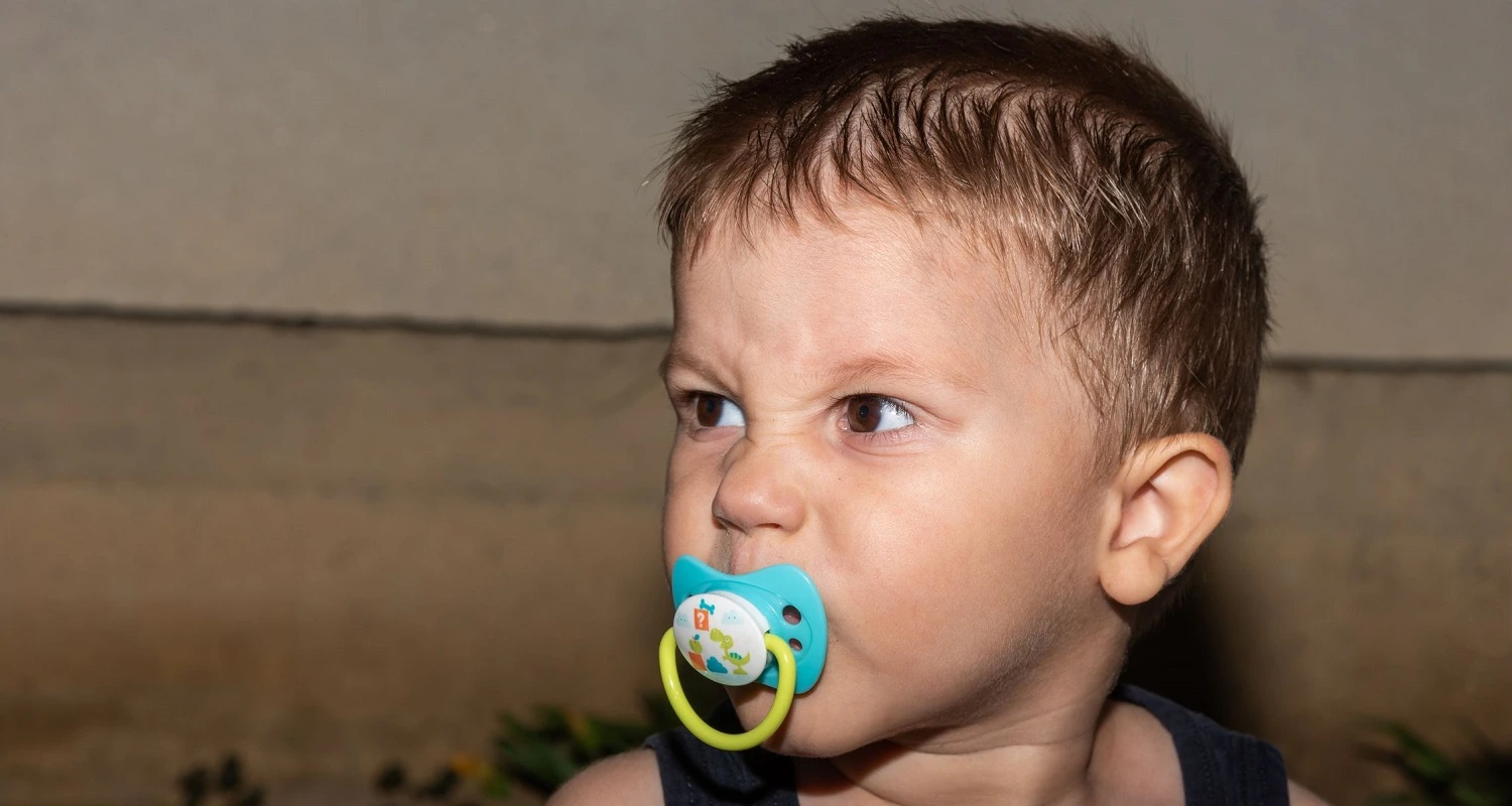 kid using a pacifier