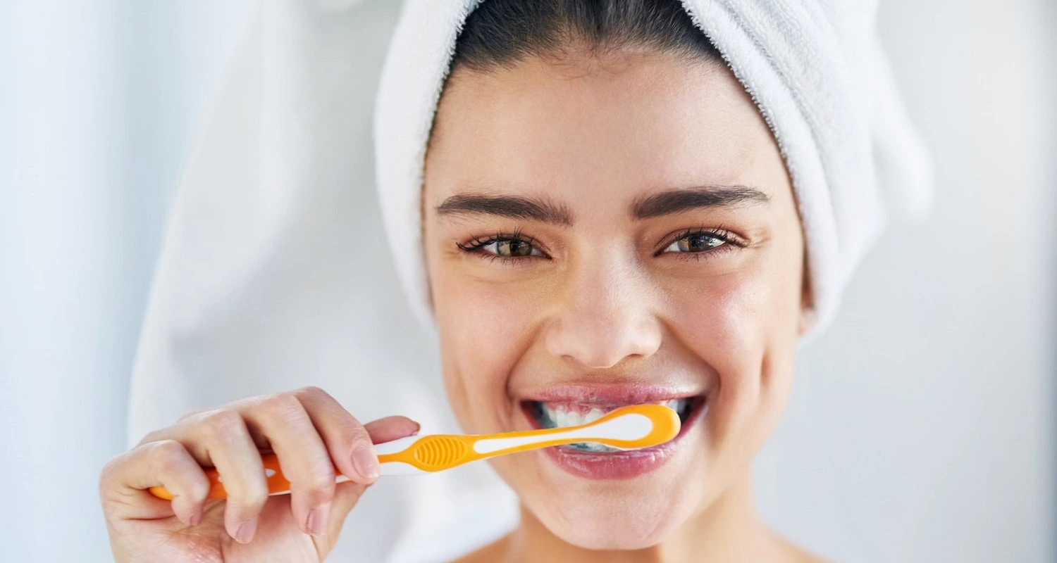 woman practicing oral hygiene
