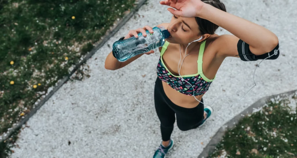 woman-drinking-water-after-her-exercise