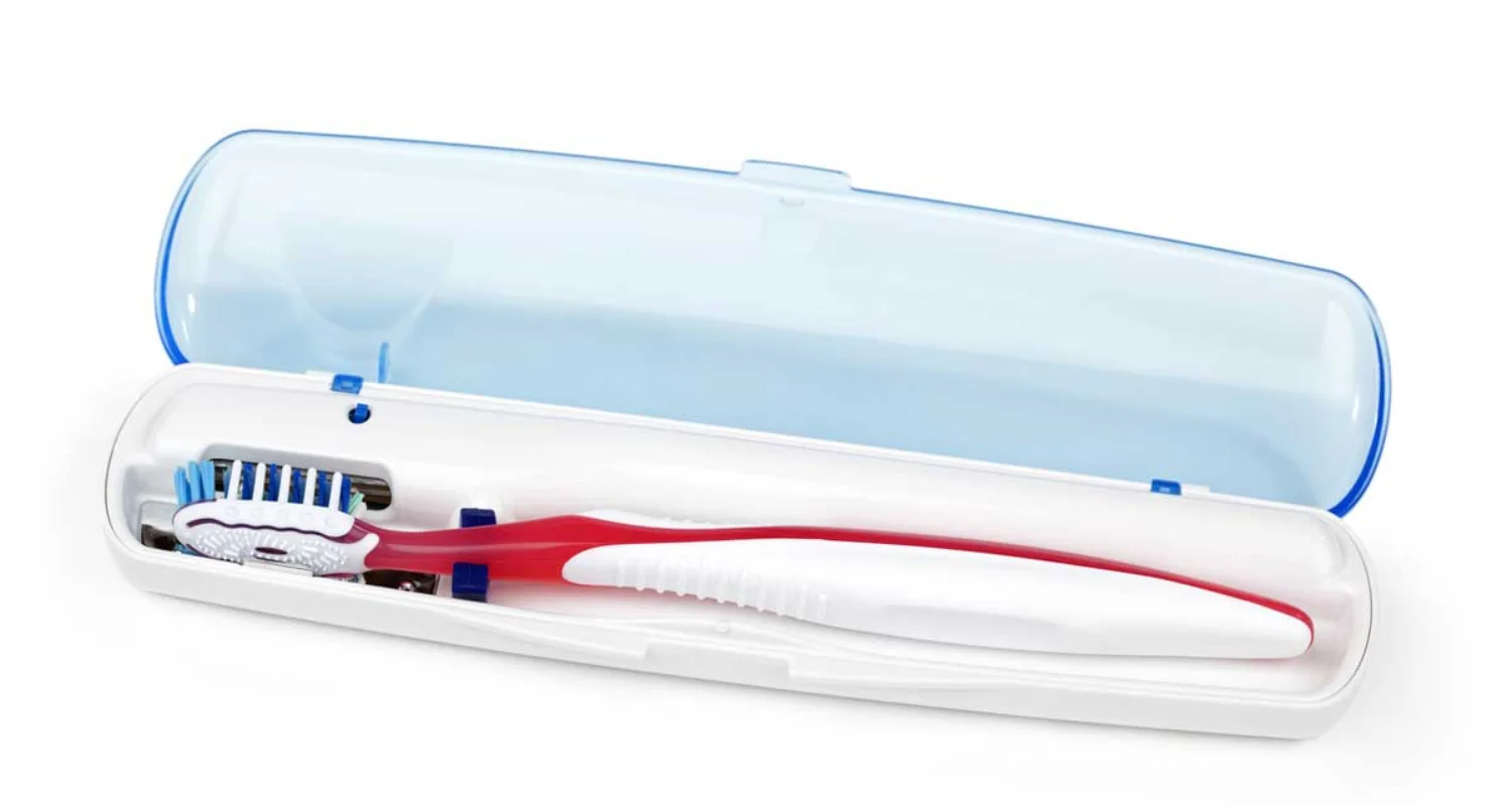 Can you use a dishwasher or UV sanitizer for disinfecting a toothbrush