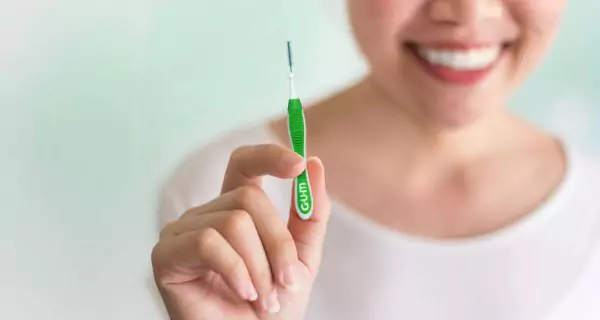 What is an interdental brush?