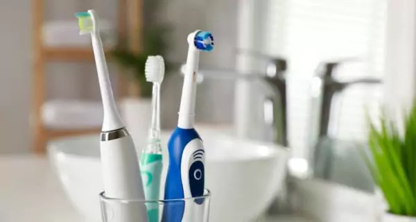 What is an electric toothbrush and how does it work?