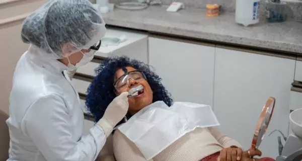 What preventive strategies help maintain oral health with MG?