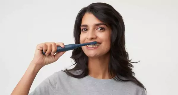 What should adults use for daily oral care?
