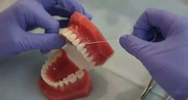 How to floss properly?