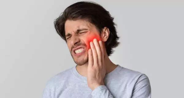 When should I see a dentist about my wisdom teeth?
