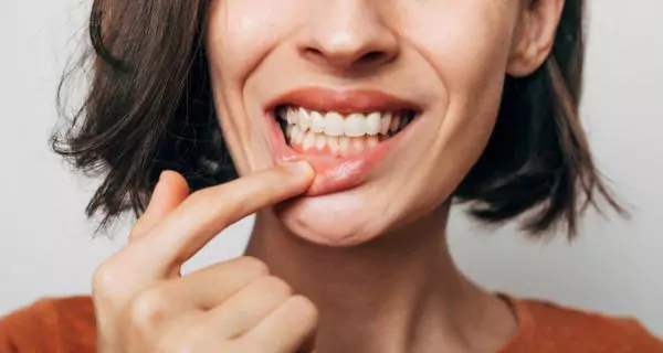 How does cheese help teeth and gums?