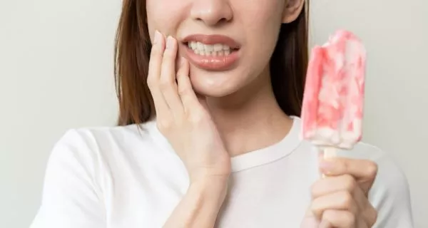 Does nail biting wear down tooth enamel?
