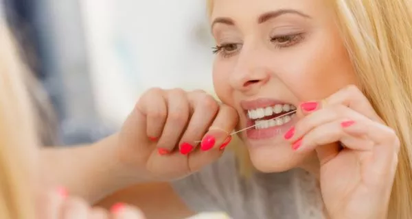 How does dental floss protect your gums and teeth?