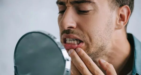 What causes a sore lingual frenulum? 5 common reasons