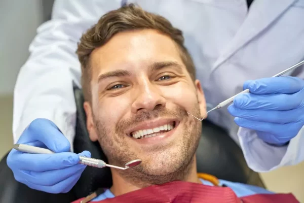 joyous-patient-feeling-alright-at-dental-check-up-1024x682-64dcf1fbd5629.webp